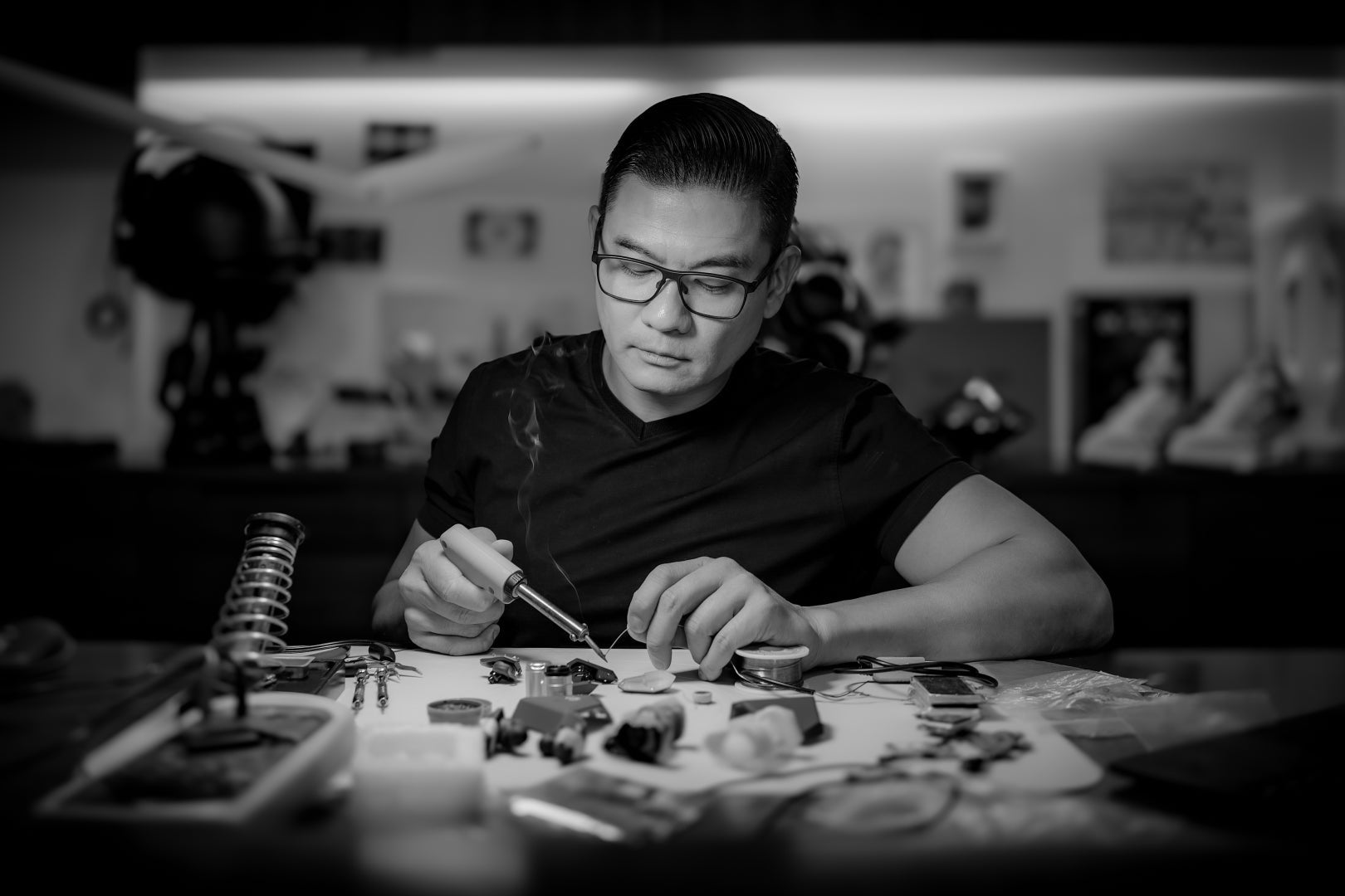 David Leung CEO at SAN Sound working on his headphone creations at his desk