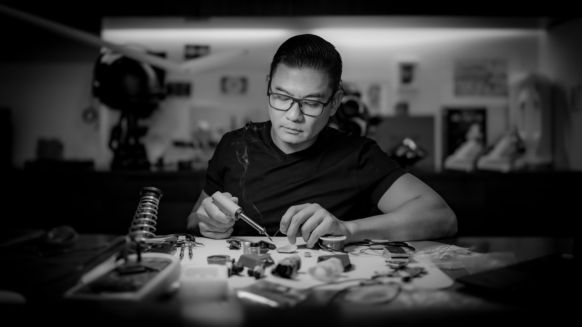 David Leung CEO at SAN Sound working on his headphone creations at his desk